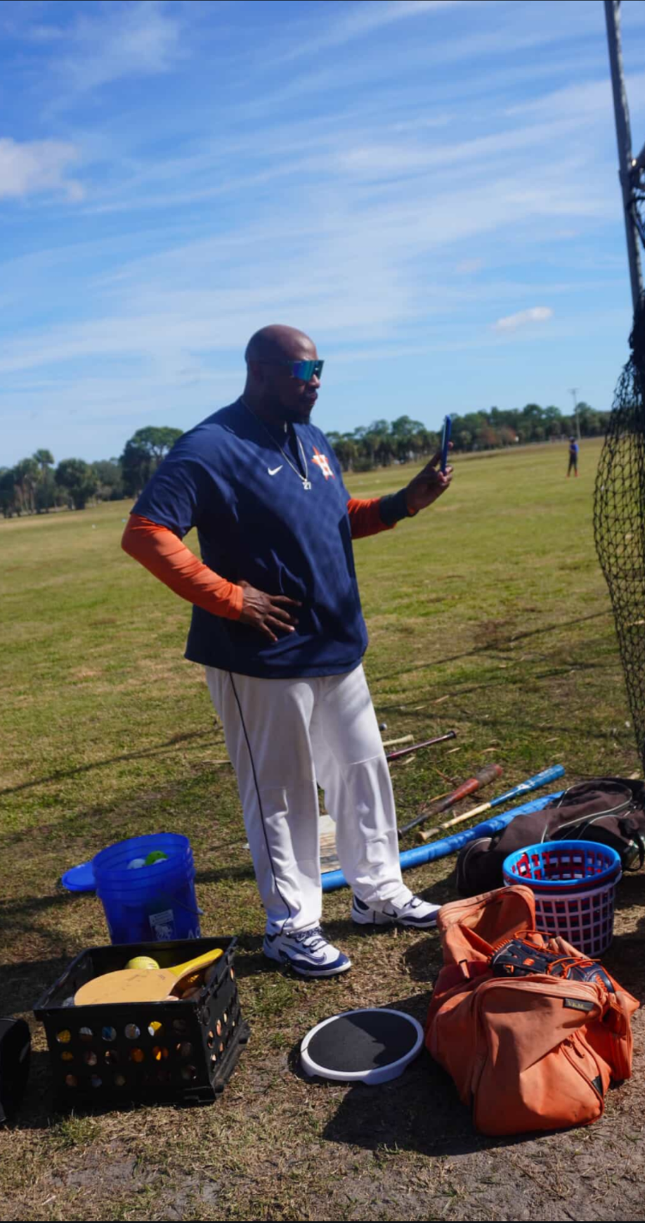 Coach K. Ross mentoring a player during a development session